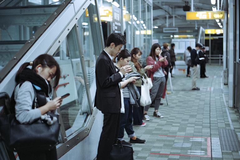 People standing inside train station